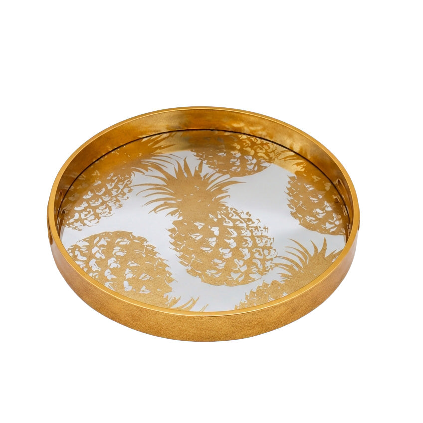 Gold decorative tray with pineapple design on a white background