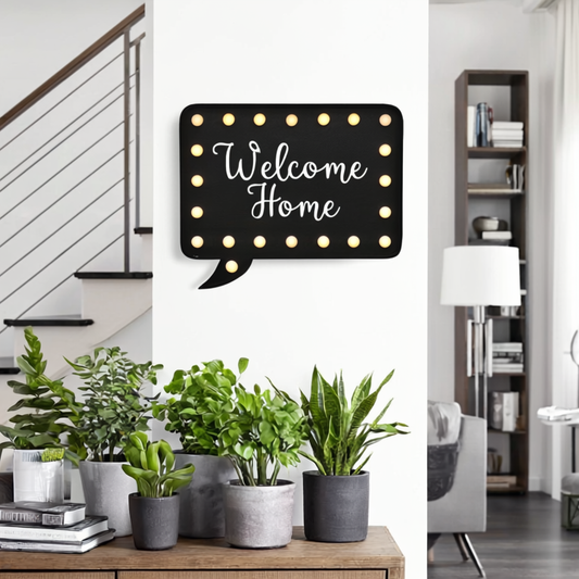 Decorative sign with 'Welcome Home' text in a modern living room setting.